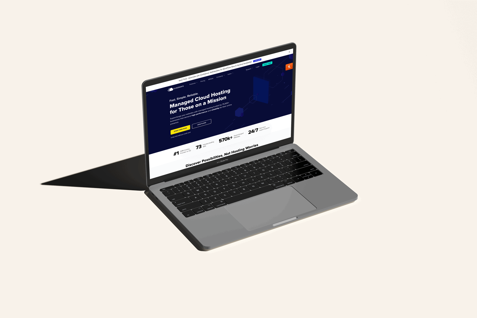 A website designer showcasing a laptop with a WordPress site.